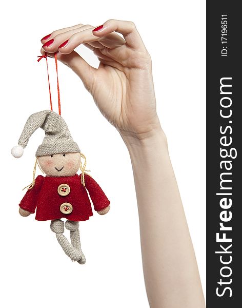 Studio photo of woman'shands playing with puppet. Dwarf on the white background. Studio photo of woman'shands playing with puppet. Dwarf on the white background.