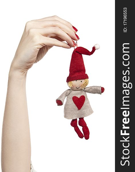 Studio photo of woman's hands playing with puppet. Dwarf on the white background. Studio photo of woman's hands playing with puppet. Dwarf on the white background.