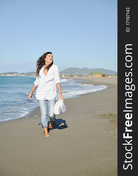 Happy young woman relax onbeautiful beach at morning. Happy young woman relax onbeautiful beach at morning