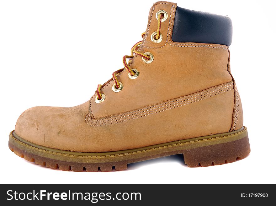 A pair of hiking boots  on white background. Shallow depth of field