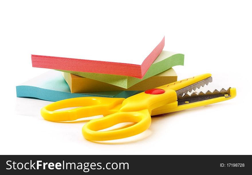 Scissors and paper for notes, white background