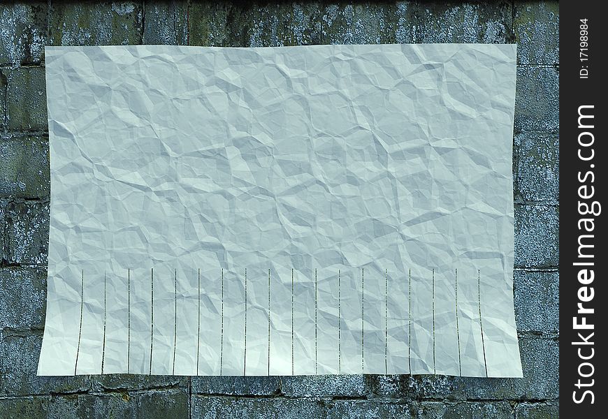 Blank, white paper ad on the wall of red brick