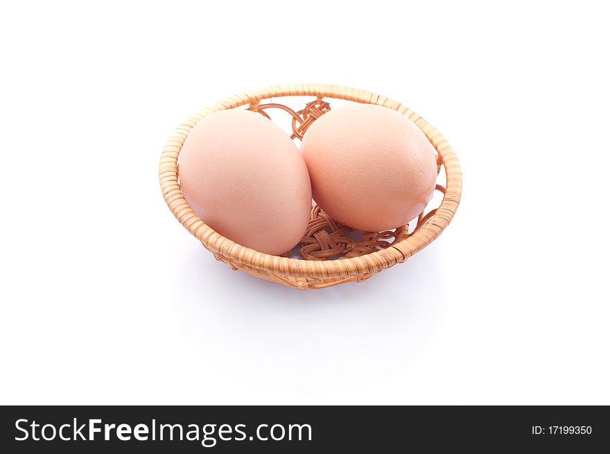 Basket with eggs  isolated on white background