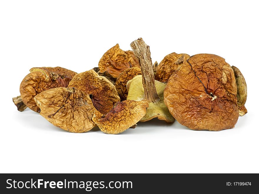 Small pile of dried cepe mushrooms isolated on the white background