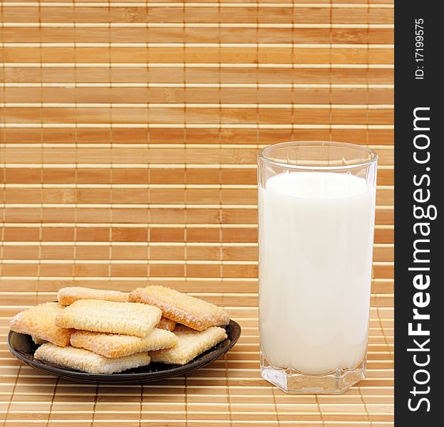 cookies and milk in a glass substrate at a straw