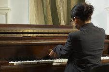 Piano Teacher Playing From Back Stock Photos