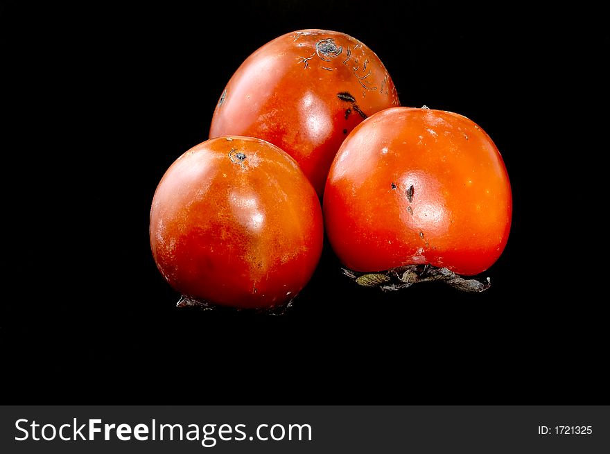 Persimmon isolated on black background. Persimmon isolated on black background