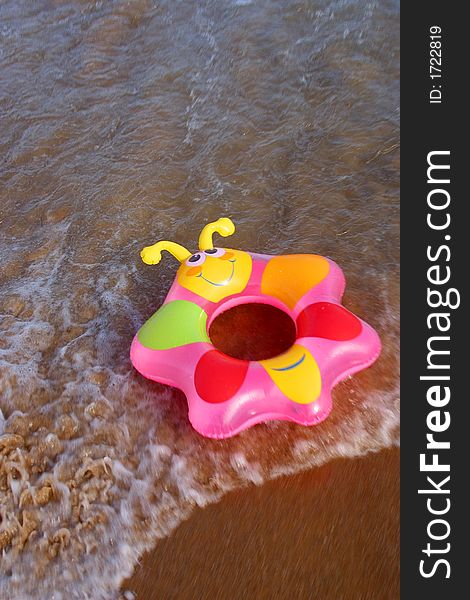 Partial view of a wave and a swimring in the bay of San Agustinillo in the southern state of Oaxaca in  Mexico, Latin America. Partial view of a wave and a swimring in the bay of San Agustinillo in the southern state of Oaxaca in  Mexico, Latin America