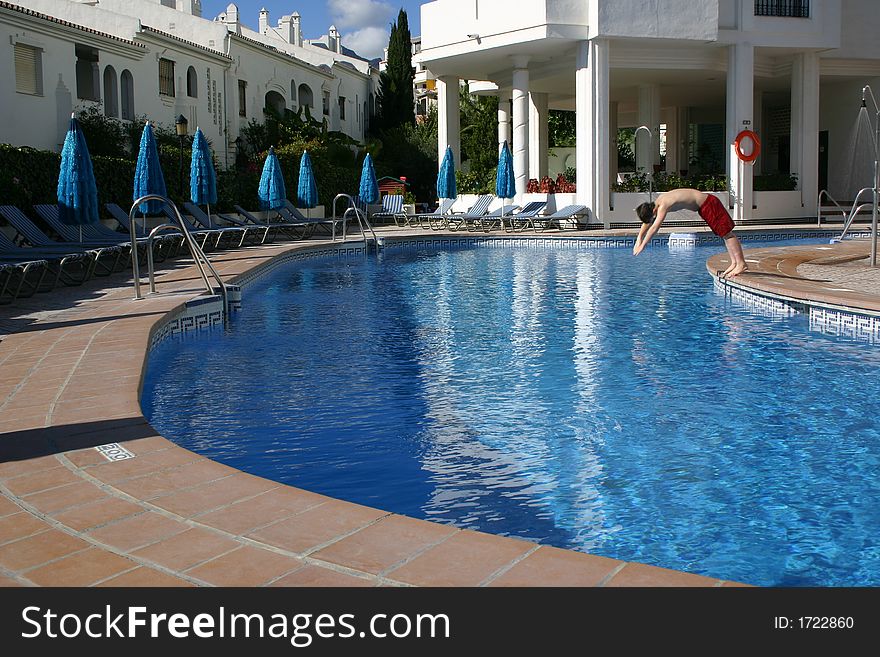 Person diving into a swimming pool