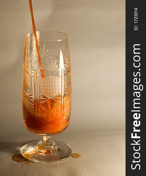 Wineglass with tomato juice, liquid, closeup. Wineglass with tomato juice, liquid, closeup