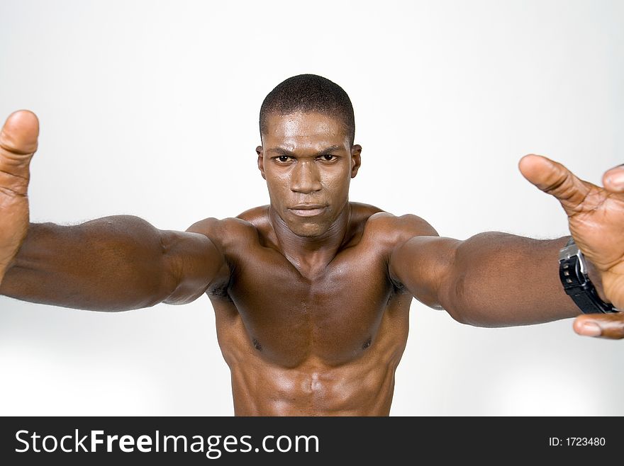 Muscular african american Athelete reaching towards you. Muscular african american Athelete reaching towards you