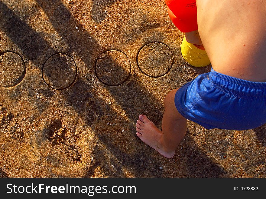 Boy playing at the beach of the bay of San Agustinillo in the southern state of Oaxaca in Mexico, Latinamerica