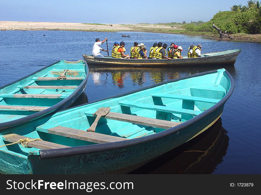 Boat in the river for the tour to a crocodile farm and to go crocodile watching in tne proximity of San Agustinillo in the southern State of Oaxaca in Mexico, Latin America