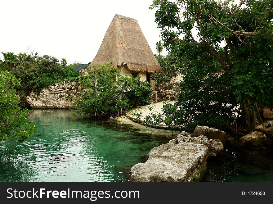 Old typical house with high roof at lake margin. Old typical house with high roof at lake margin