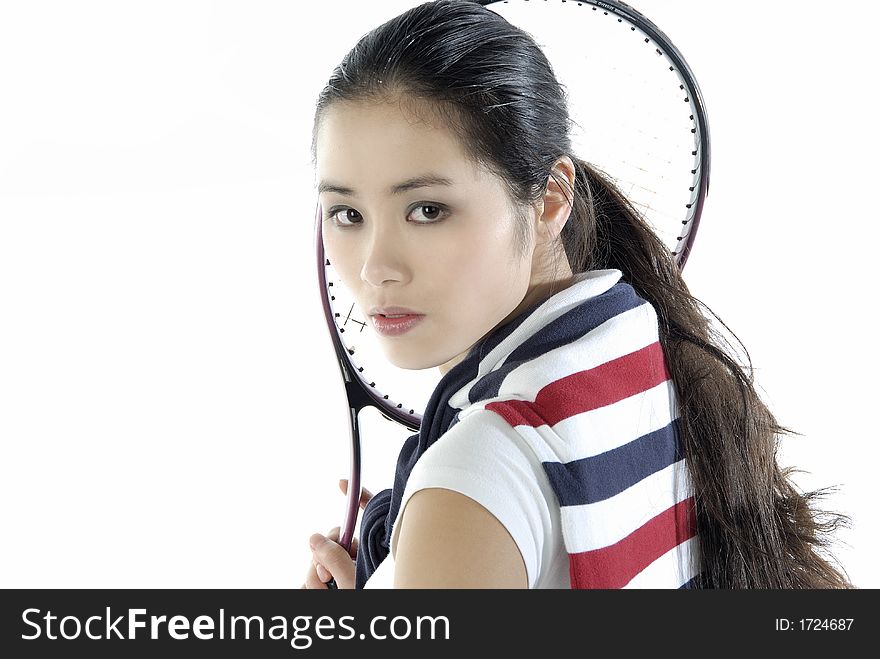 Studio portrait of a asian girl with a tennis racket. Studio portrait of a asian girl with a tennis racket