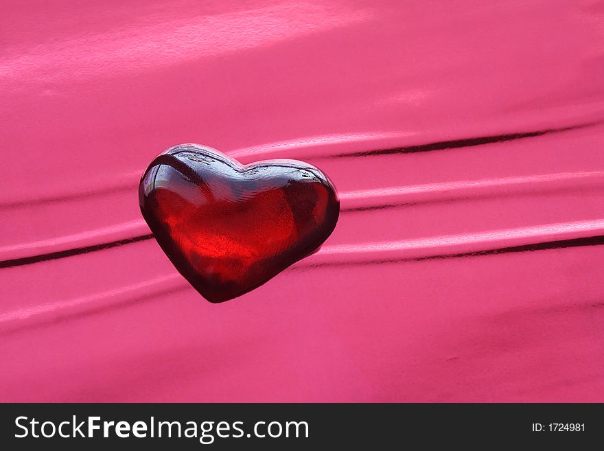 Valentine heart on the red background - the symbol of love. Valentine heart on the red background - the symbol of love