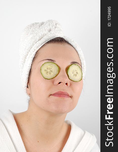 Attractive woman with cucumbers slice on her eyes. Attractive woman with cucumbers slice on her eyes