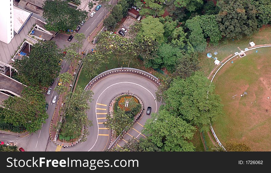 Road leading to mountain showing hairpin curve