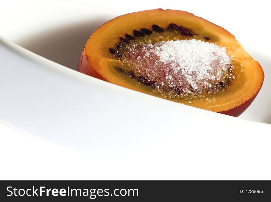 Tropical fruit tamarillo with brown sugar, isolated on white