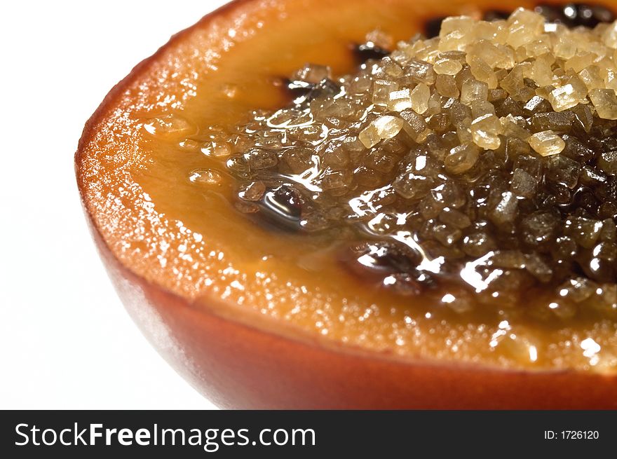Tropical fruit tamarillo with brown sugar, isolated on white