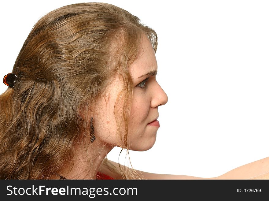 Young attractive woman looking to the right with angry expression at white space with room for text. Young attractive woman looking to the right with angry expression at white space with room for text