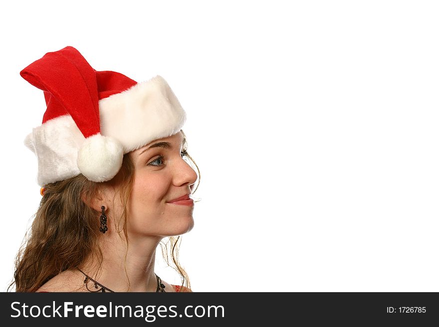 Pretty blonde lady with blue eyes and dimples wearing a santa hat and smiling. Pretty blonde lady with blue eyes and dimples wearing a santa hat and smiling