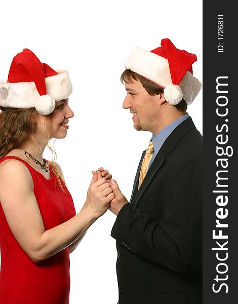 Young couple wearing Santa hats at Christmas. Young couple wearing Santa hats at Christmas