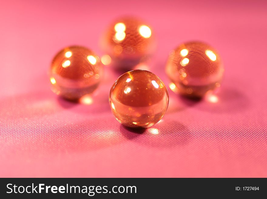 A close-up of glisten balls on the purple