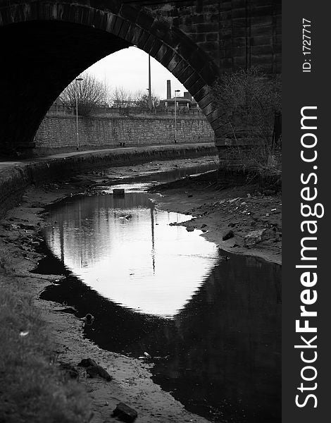 Railway bridge over Leeds canal taken in black and white. Railway bridge over Leeds canal taken in black and white