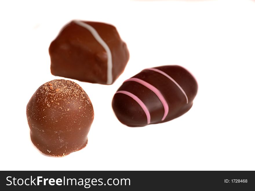 Three pieces of chocolate isolated on white background