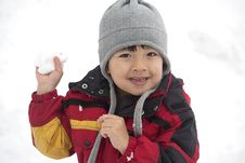Young Boy With Snowball In Hand. Royalty Free Stock Photography Young Boy With Snowball In Hand. Royalty Free Stock Photography