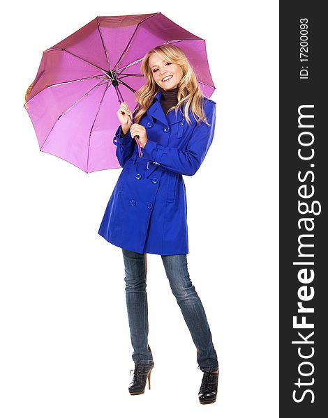 Lovely woman in a blue coat with umbrella