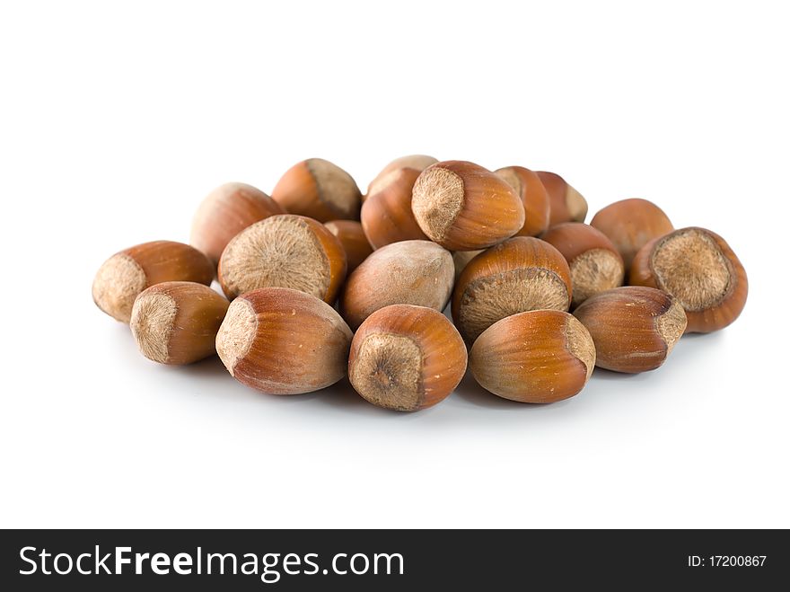Heap of hazelnuts isolated on a white background