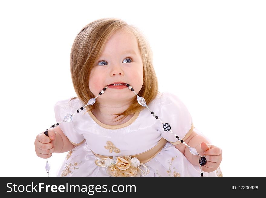 Adorable Baby Girl playing with beads isolated on white