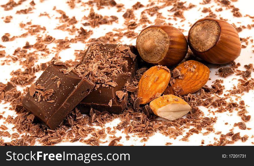 Chocolate pieces with shavings and whole almonds with two in their shells