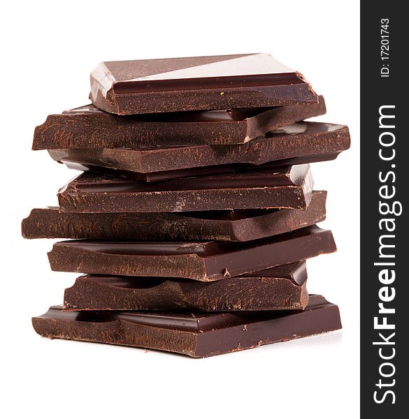 Stack of rich dark chocolate on a white background. Stack of rich dark chocolate on a white background