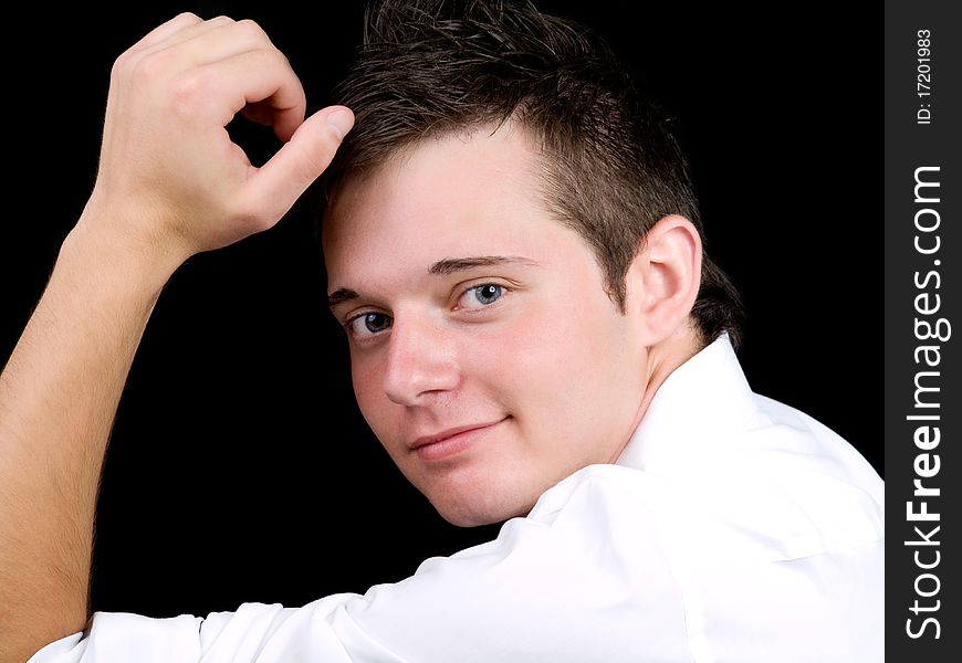 Portrait of young businessman over black background. Portrait of young businessman over black background