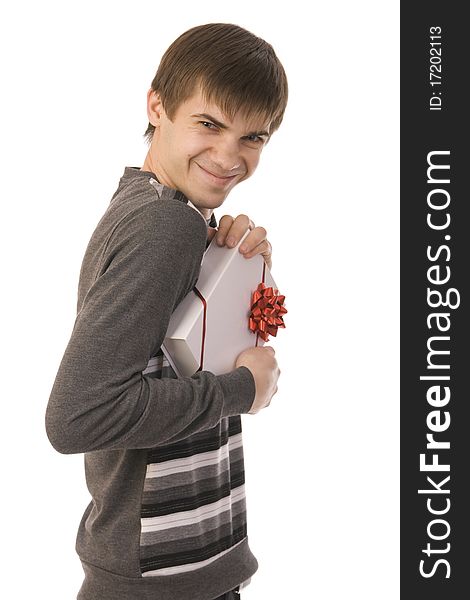 Handsome smiley man holding gift. isolated on white background