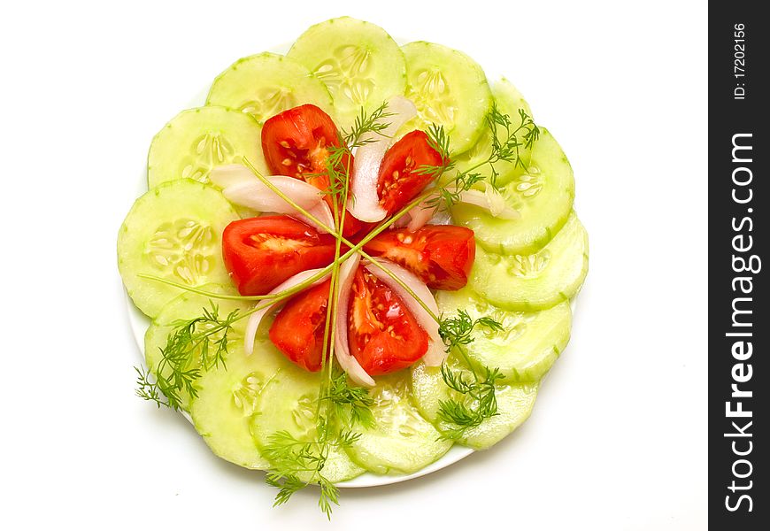 Fresh vegetables on a plate on white background. Fresh vegetables on a plate on white background