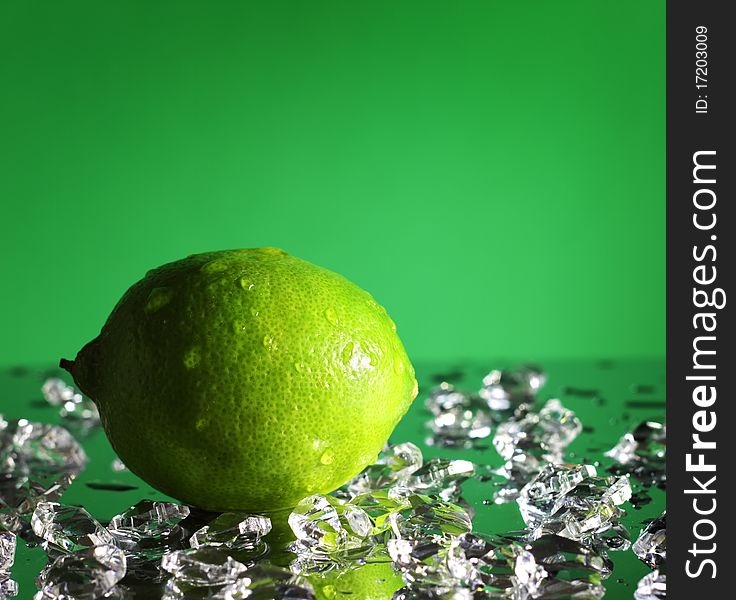 Whole lime on a green background