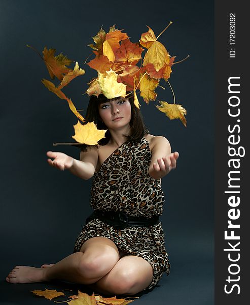 The girl with falling maple leaves