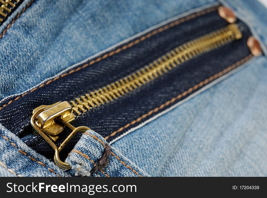 Closeup of a zipped pocket of jeans. Closeup of a zipped pocket of jeans