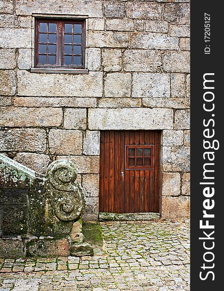 Detail of a very old house facade. Detail of a very old house facade