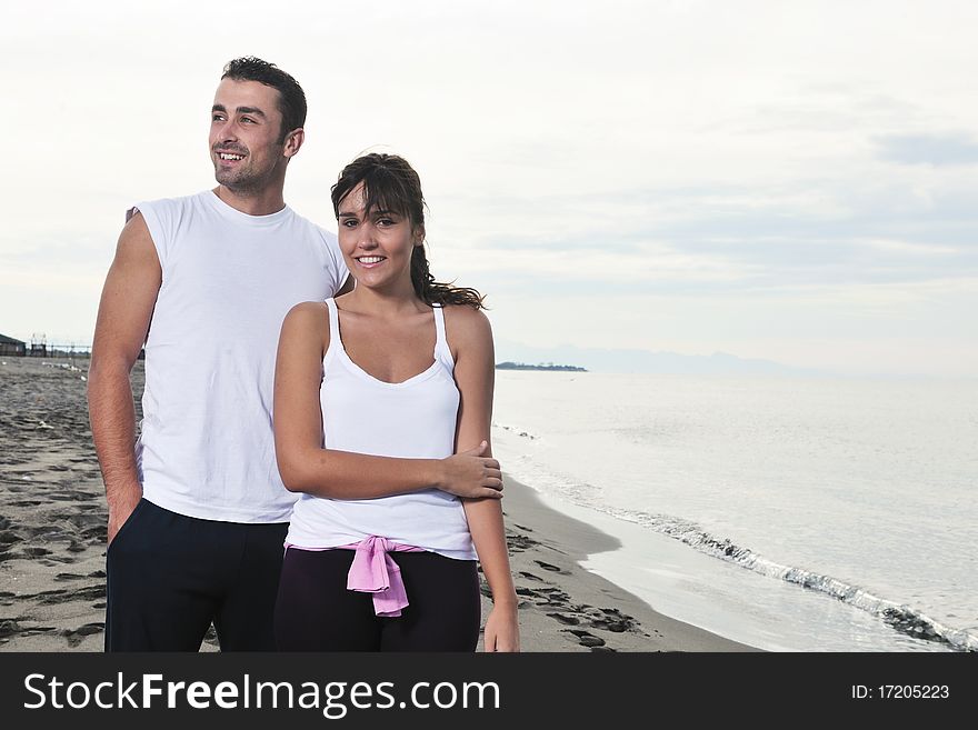 Happy young couple have fun at beautiful beach