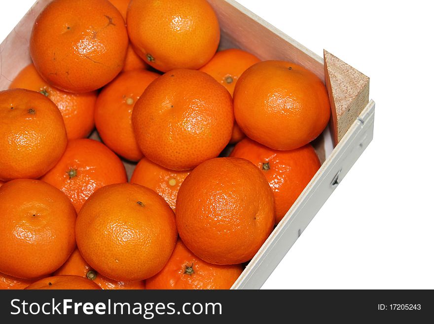 An wooden box with oranges. An wooden box with oranges