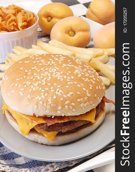 Cheeseburger with fries on the plate