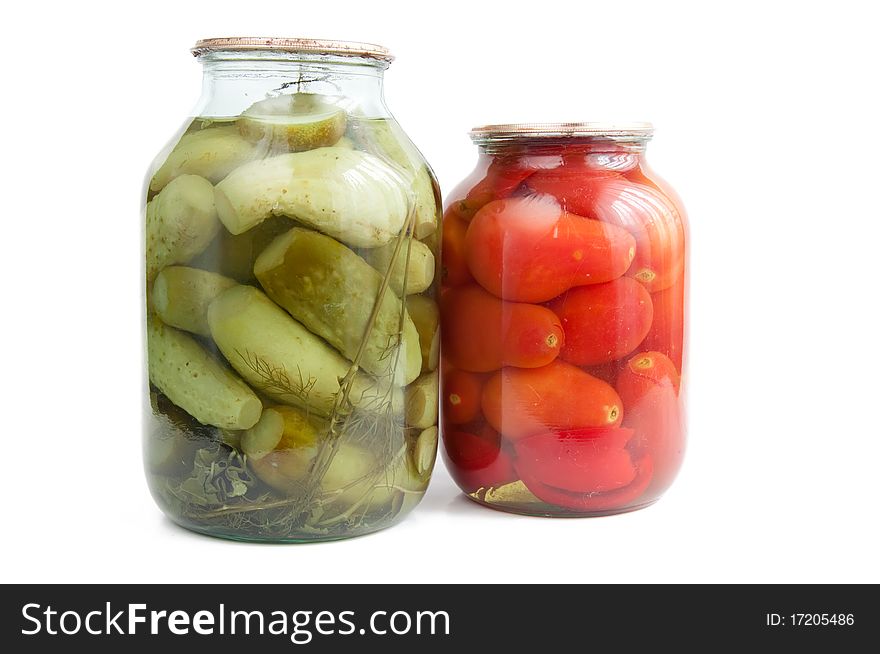 Canned cucumbers and tomatoes on white background