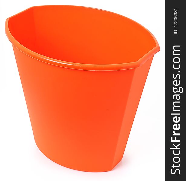 Small orange plastic garbage bin over white background. Clean unused.