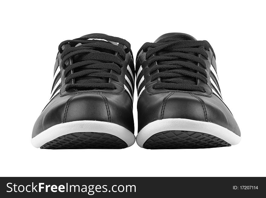 Black sneakers with white strips isolated on white background