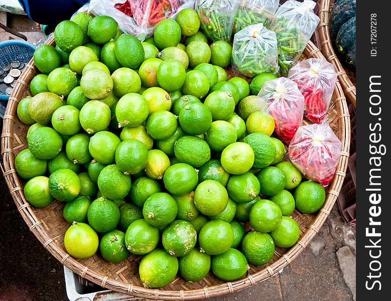 The Green lime with red chili at market